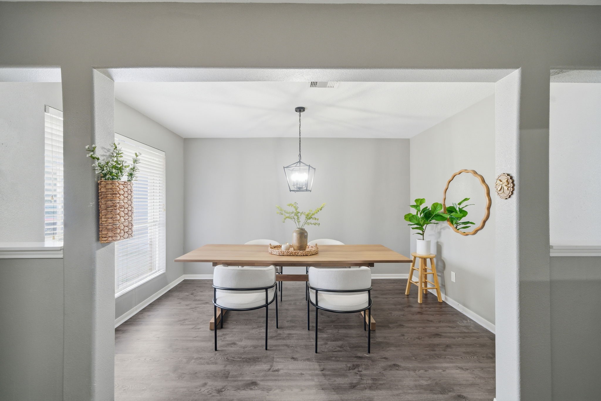 14422 Leafy Tree Drive Houston, TX 77090 - Photo 16 of 40 a dining room with furniture potted plants and wooden floor