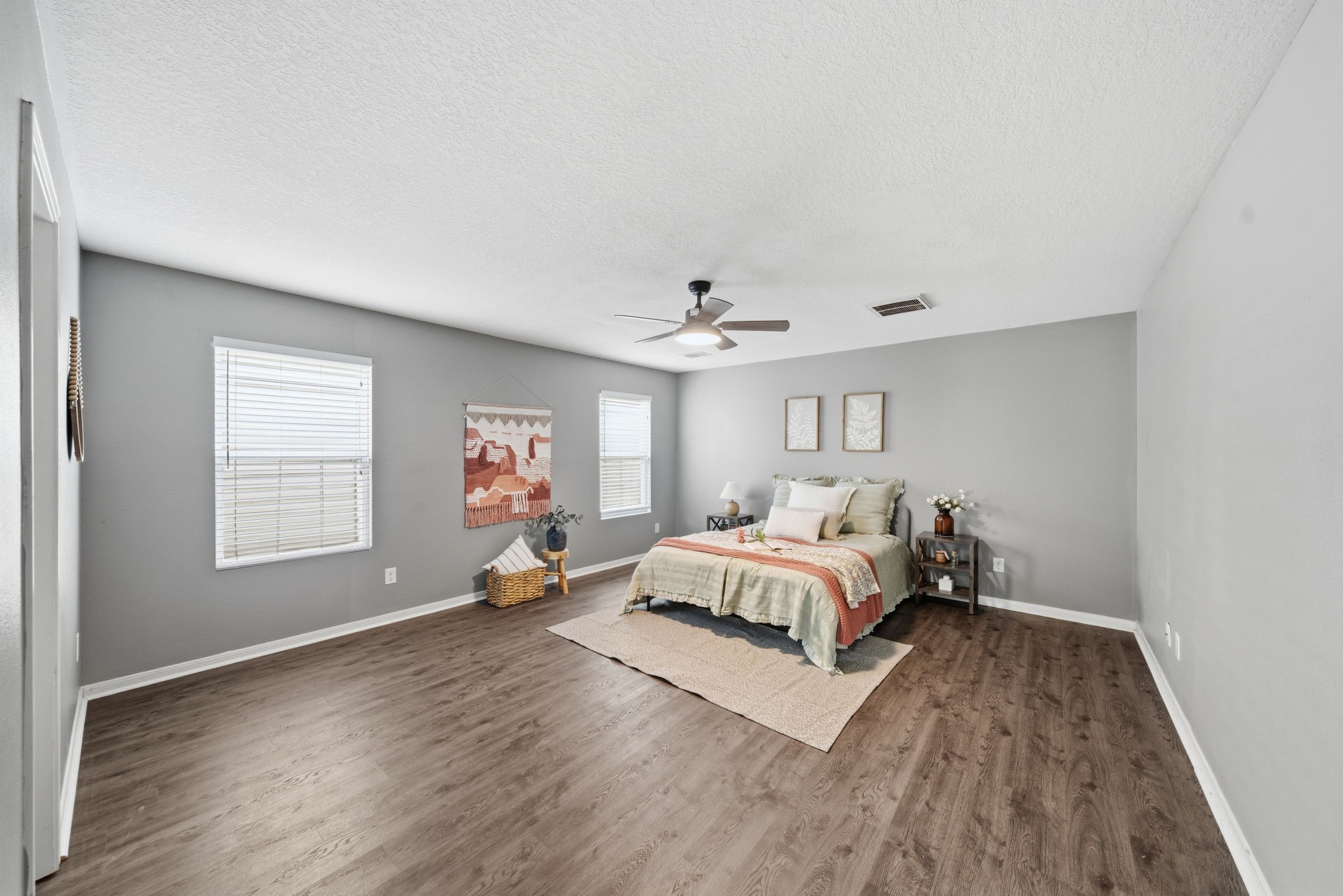14422 Leafy Tree Drive Houston, TX 77090 - Photo 19 of 40 a spacious bedroom with a bed and a window