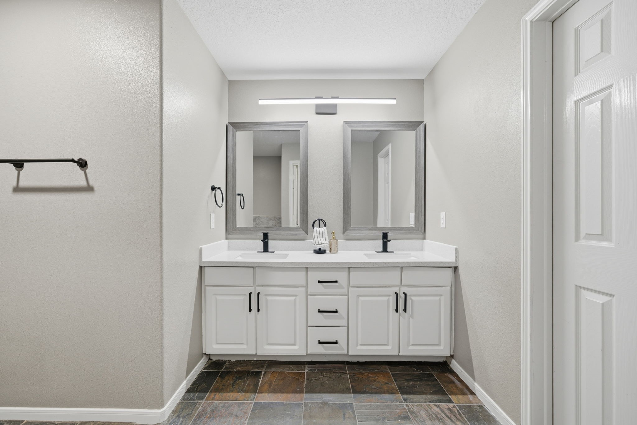 14422 Leafy Tree Drive Houston, TX 77090 - Photo 20 of 40 a bathroom with a double vanity sink and mirror