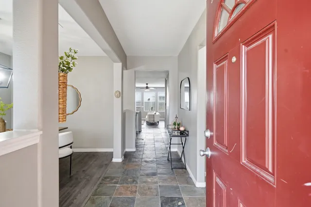 a bathroom with a glass door shower and a sink