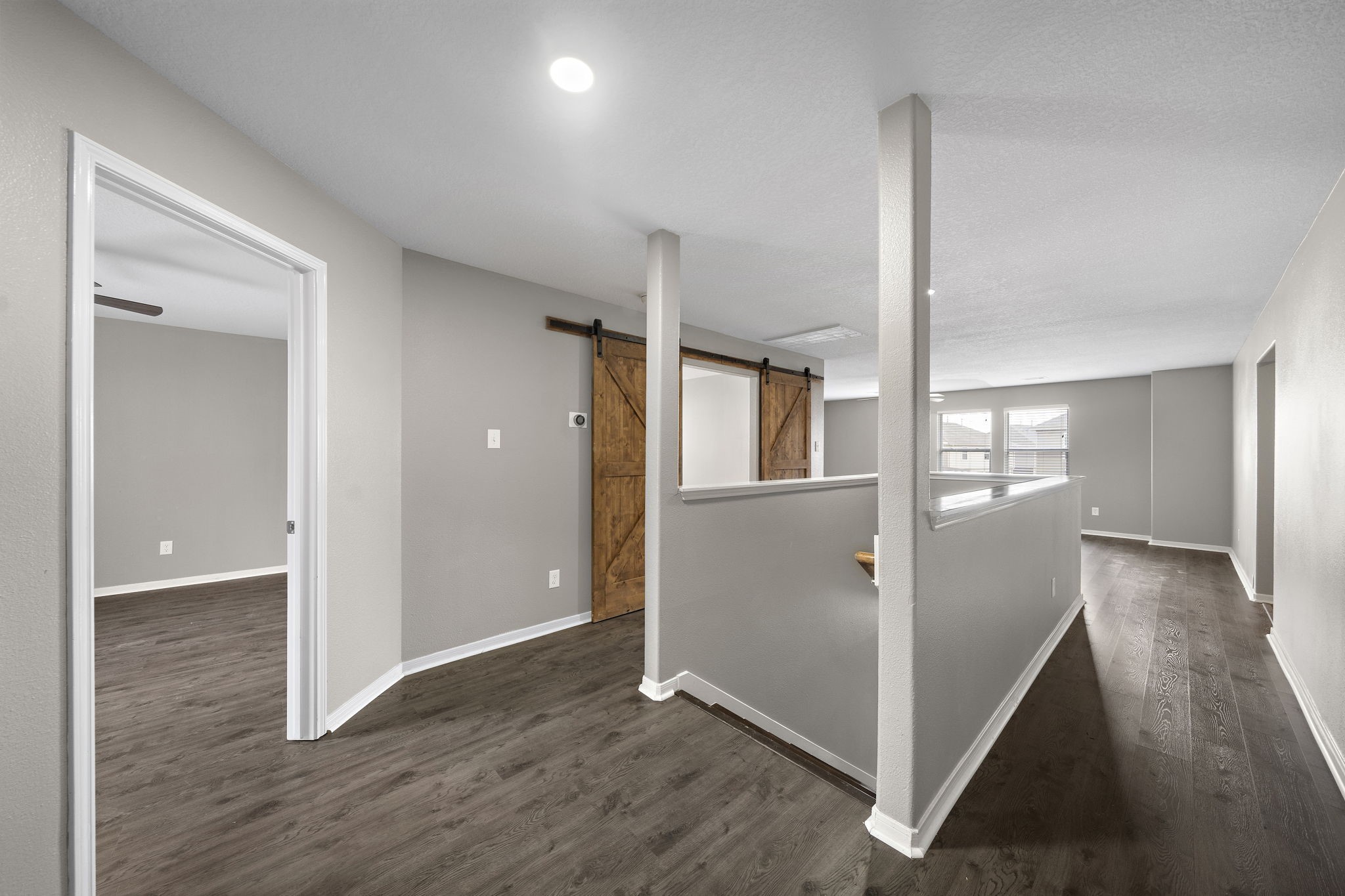 14422 Leafy Tree Drive Houston, TX 77090 - Photo 23 of 40 a view of a hallway with wooden floor