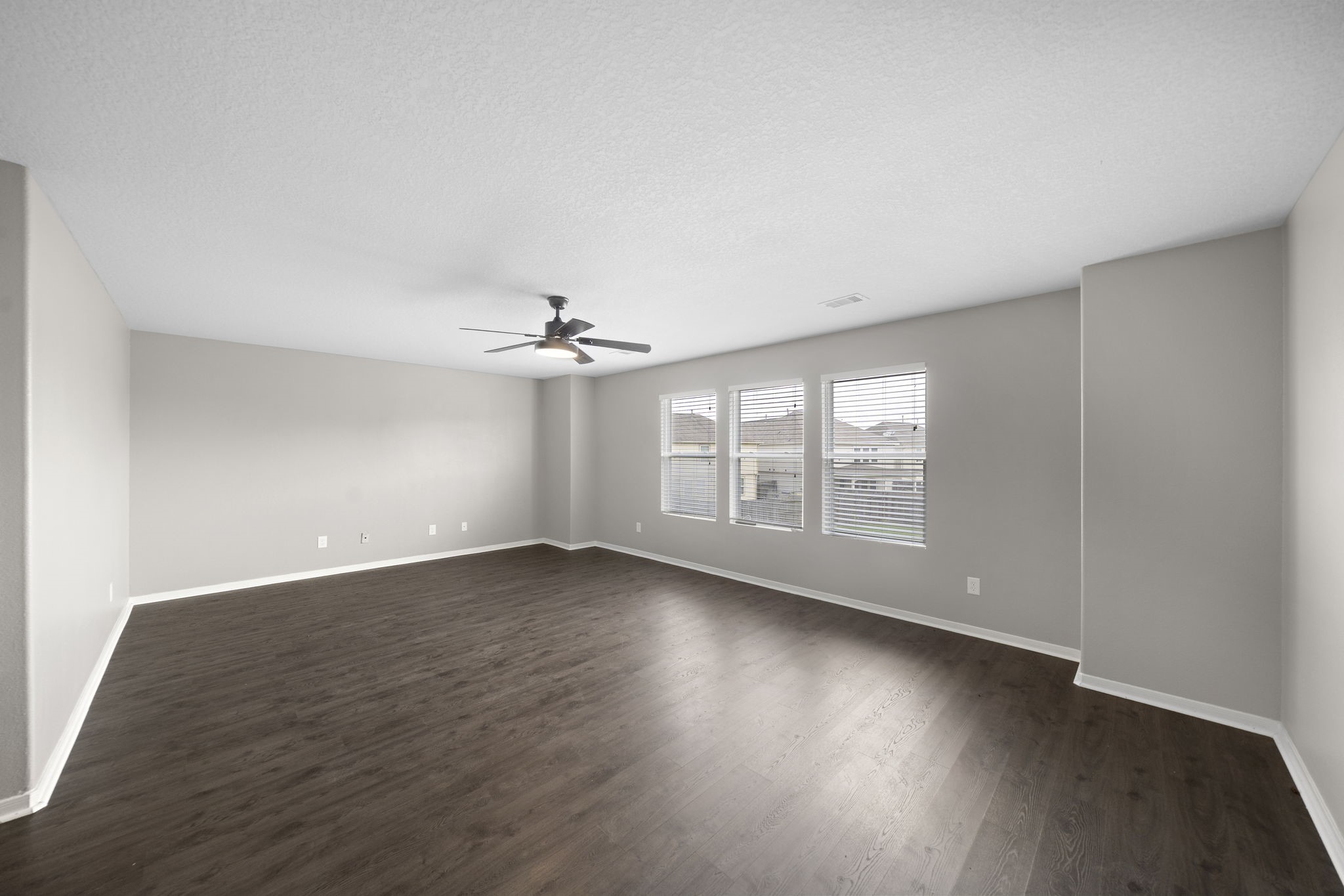 14422 Leafy Tree Drive Houston, TX 77090 - Photo 25 of 40 an empty room with wooden floor and windows