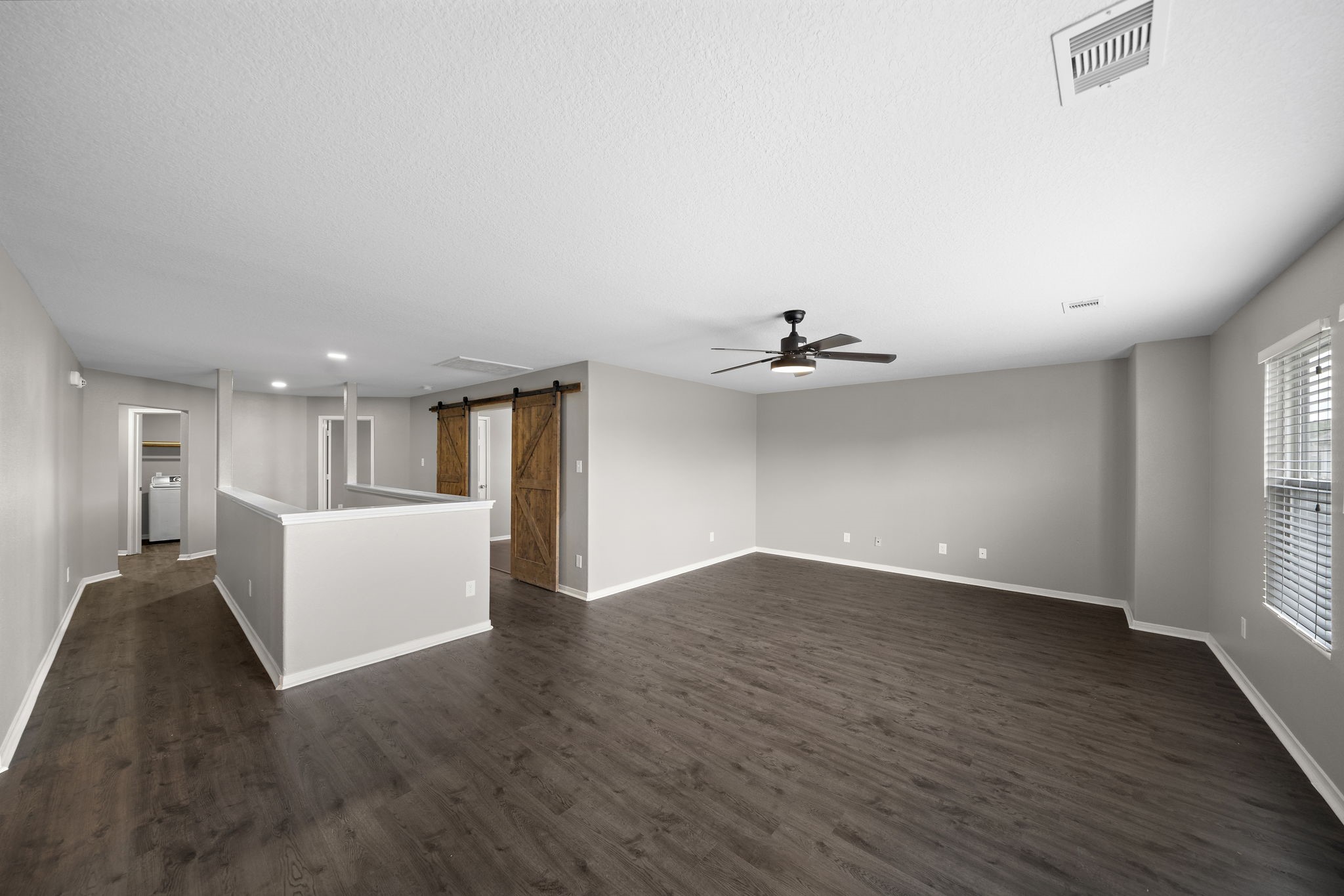 14422 Leafy Tree Drive Houston, TX 77090 - Photo 26 of 40 wooden floor in an empty room with a window