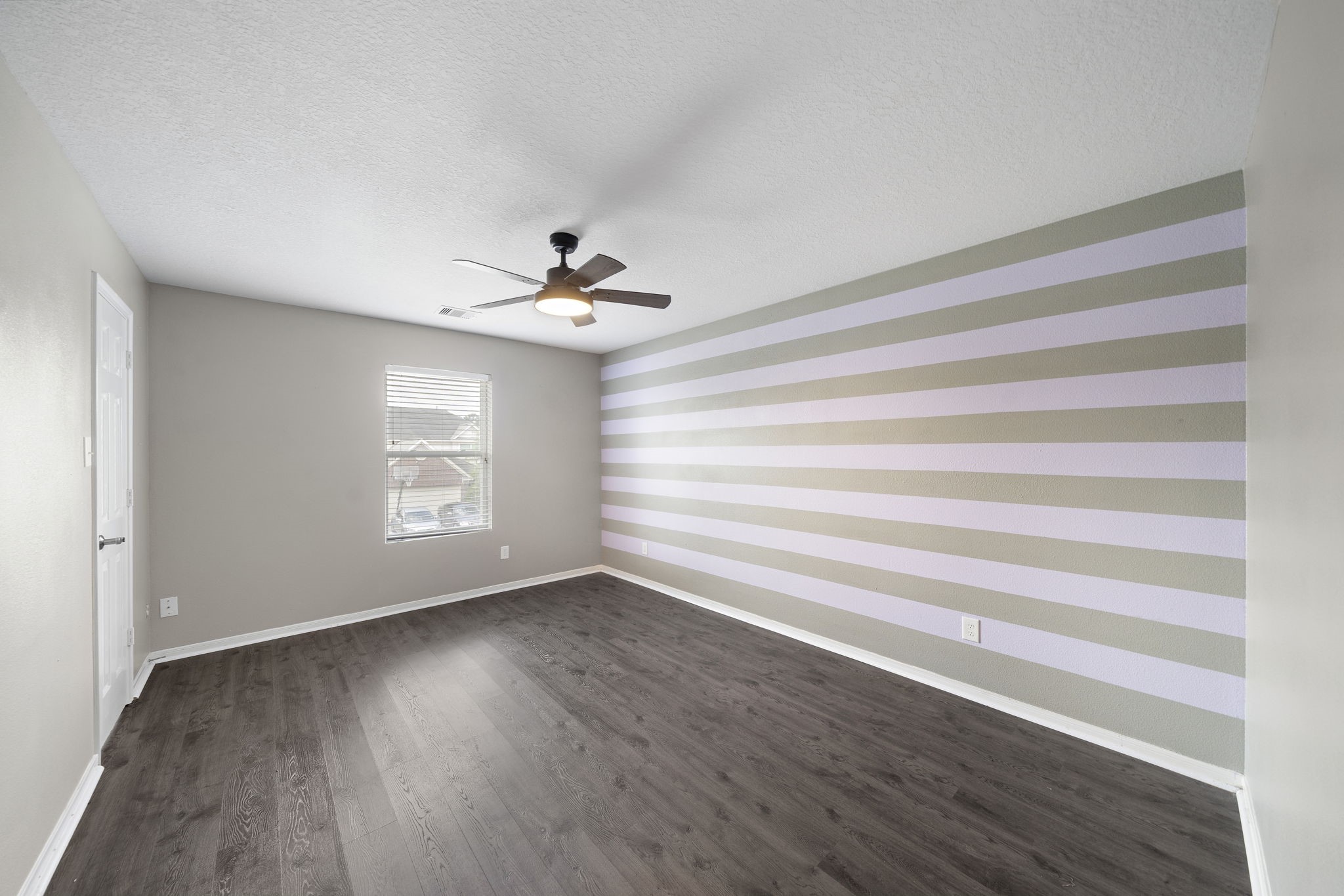 14422 Leafy Tree Drive Houston, TX 77090 - Photo 32 of 40 a view of room with window and hardwood floor