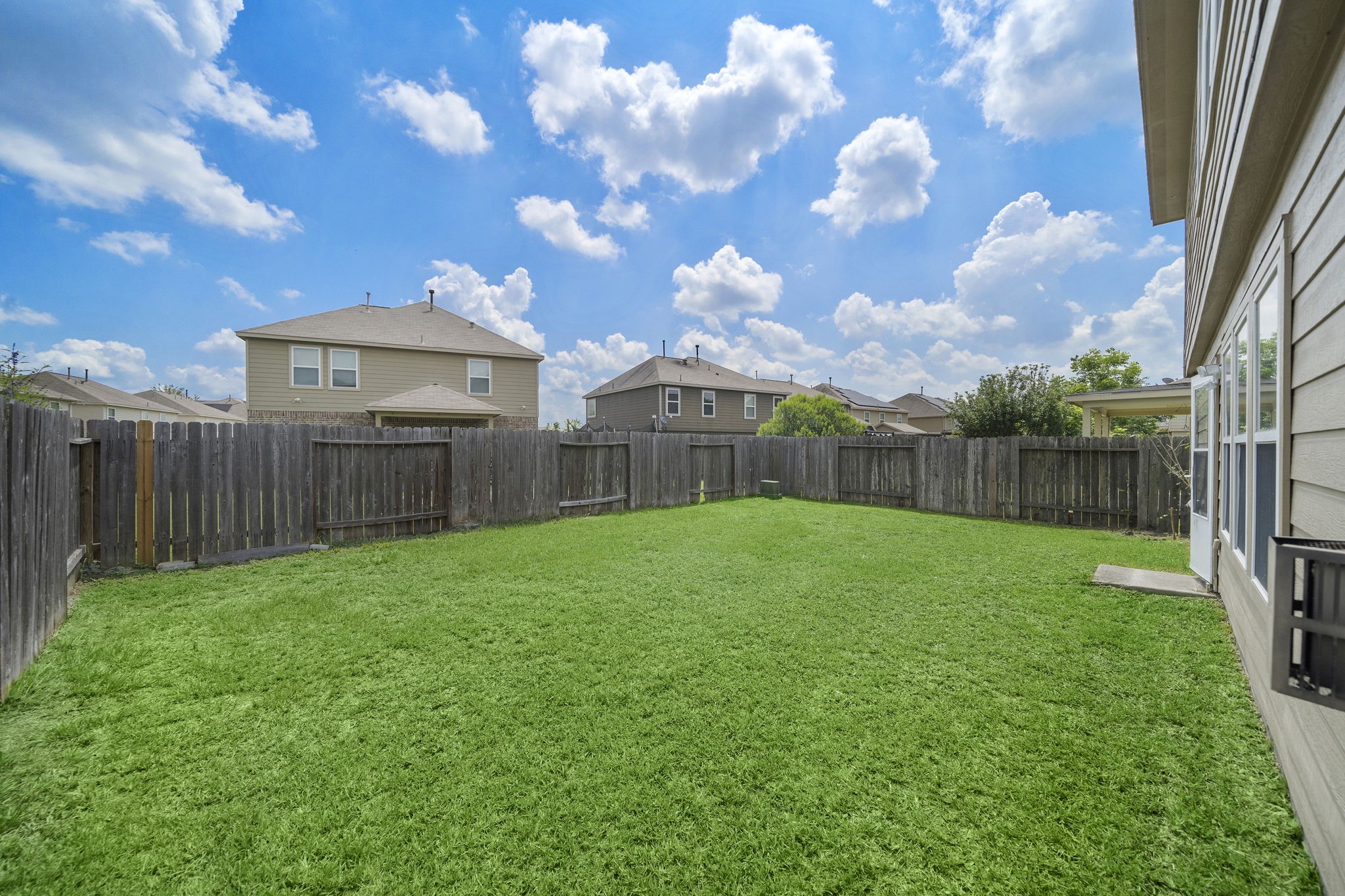 14422 Leafy Tree Drive Houston, TX 77090 - Photo 37 of 40 a view of a backyard with wooden fence