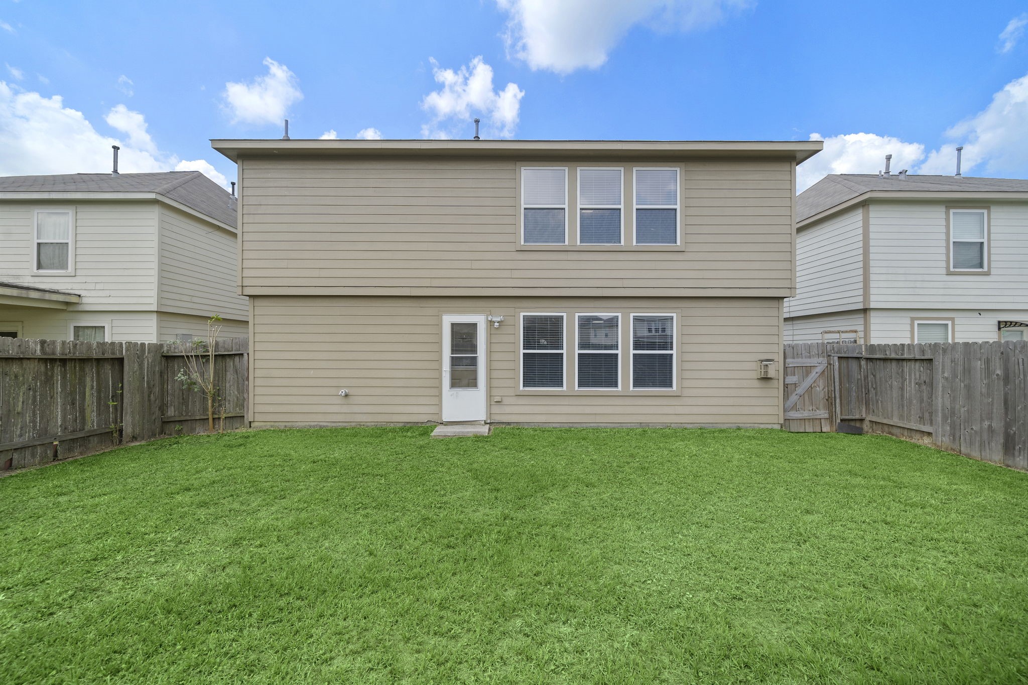 14422 Leafy Tree Drive Houston, TX 77090 - Photo 39 of 40 a view of a house with a yard