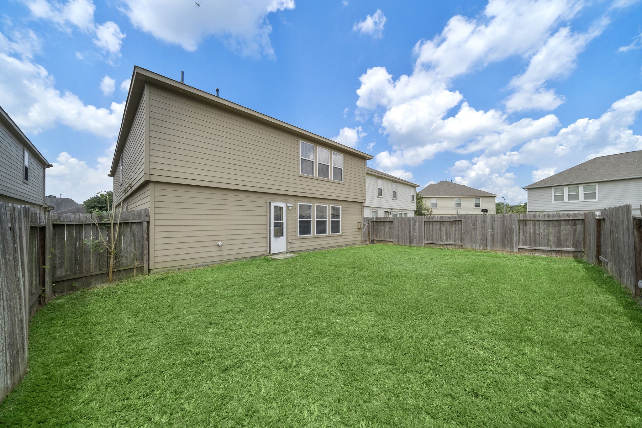 14422 Leafy Tree Drive Houston, TX 77090 - Photo 40 of 40 a view of a house with backyard and garden