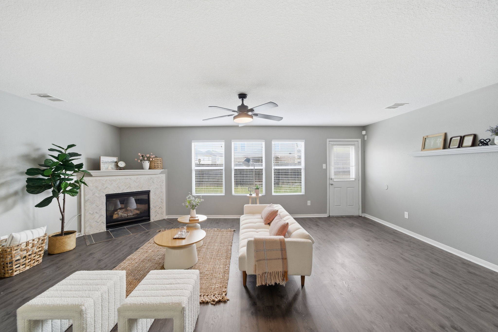 14422 Leafy Tree Drive Houston, TX 77090 - Photo 7 of 40 a living room with furniture a fireplace and a large window
