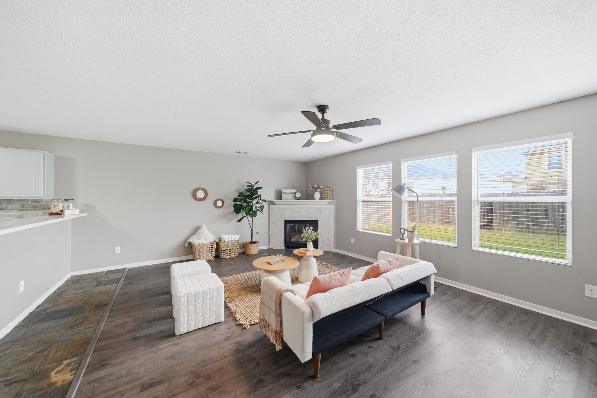 14422 Leafy Tree Drive Houston, TX 77090 - Photo 10 of 40 a living room with furniture large window and a fireplace