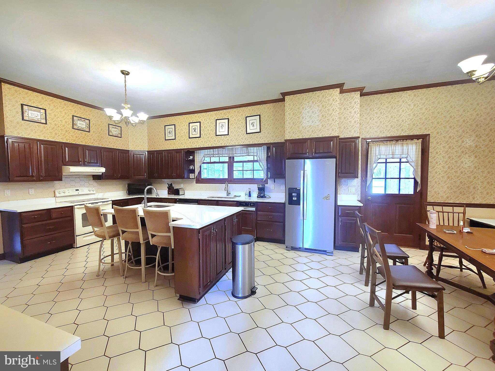 13212 Beaver Dam Road Cockeysville, MD 21030 - Photo 11 of 55 a kitchen with a cabinets counter top space a sink stainless steel appliances and cabinets