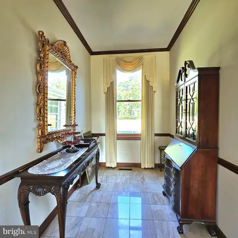 a living room with furniture rug and wooden floor