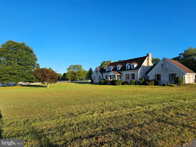 a view of a house with a big yard