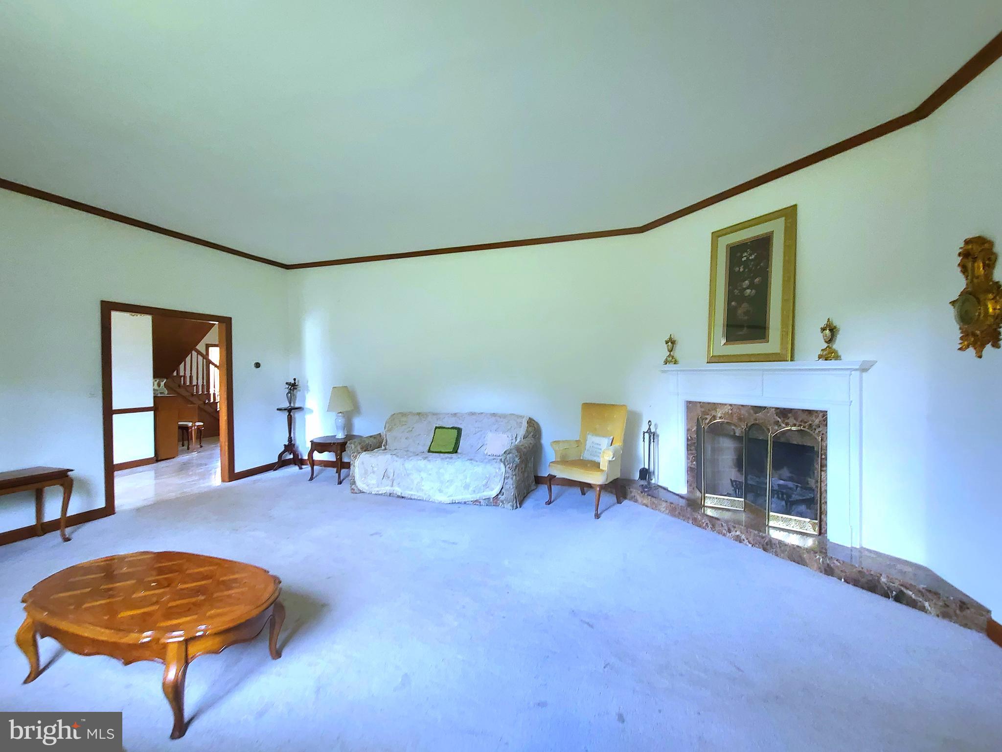 13212 Beaver Dam Road Cockeysville, MD 21030 - Photo 24 of 55 a living room with furniture and a fireplace