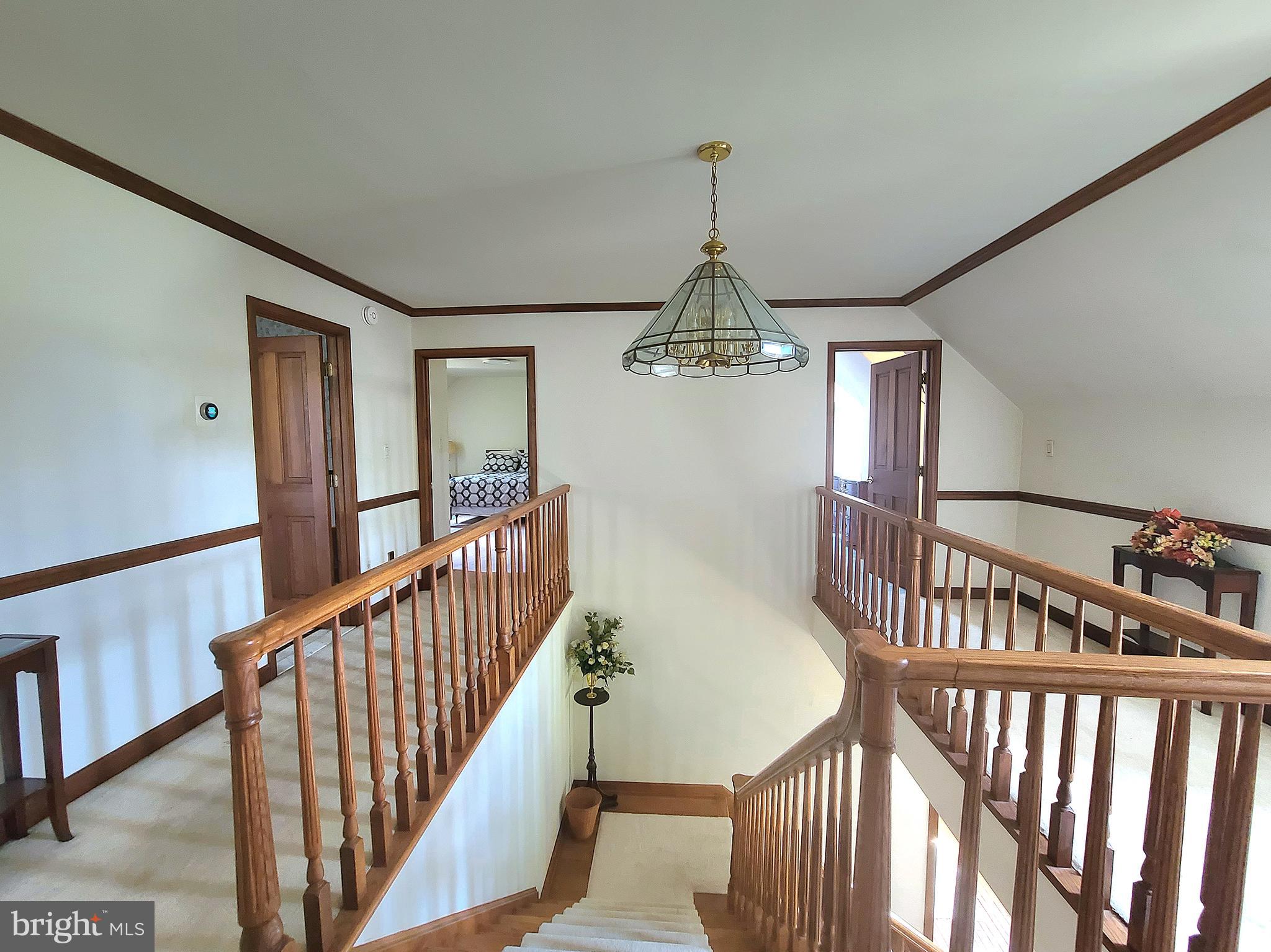 13212 Beaver Dam Road Cockeysville, MD 21030 - Photo 30 of 55 a view of staircase with railing and wooden floor