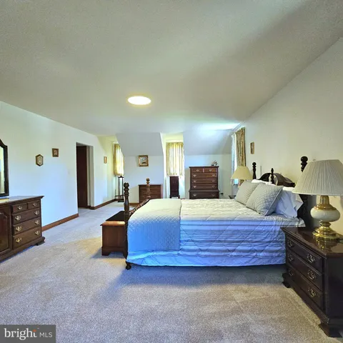 a bedroom with bed and window