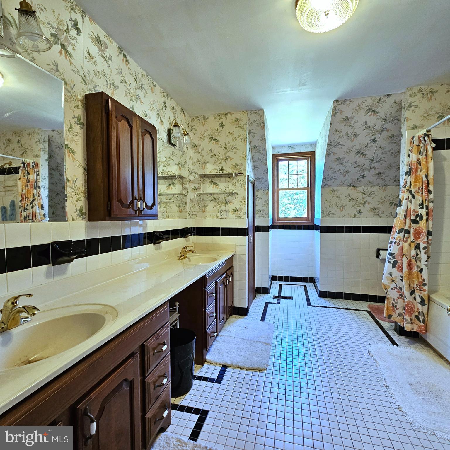 13212 Beaver Dam Road Cockeysville, MD 21030 - Photo 36 of 55 a spacious bathroom with a sink a vanity and a mirror