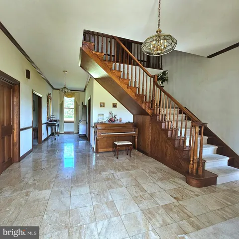 a kitchen with a cabinets counter top space a sink stainless steel appliances and cabinets