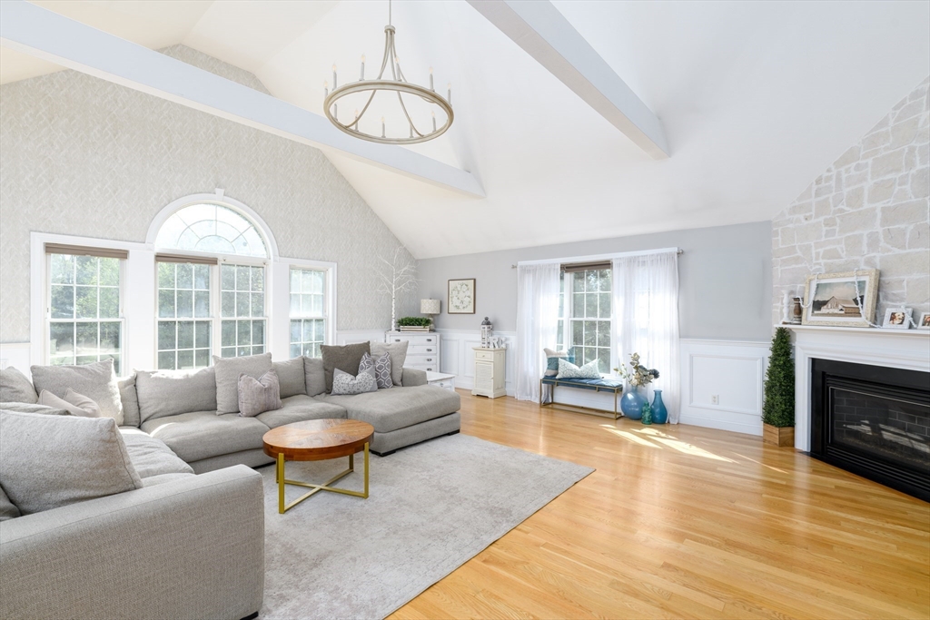 27 Vista Circle Rutland, MA 01543 - Photo 7 of 35 a living room with furniture a fireplace and a large window