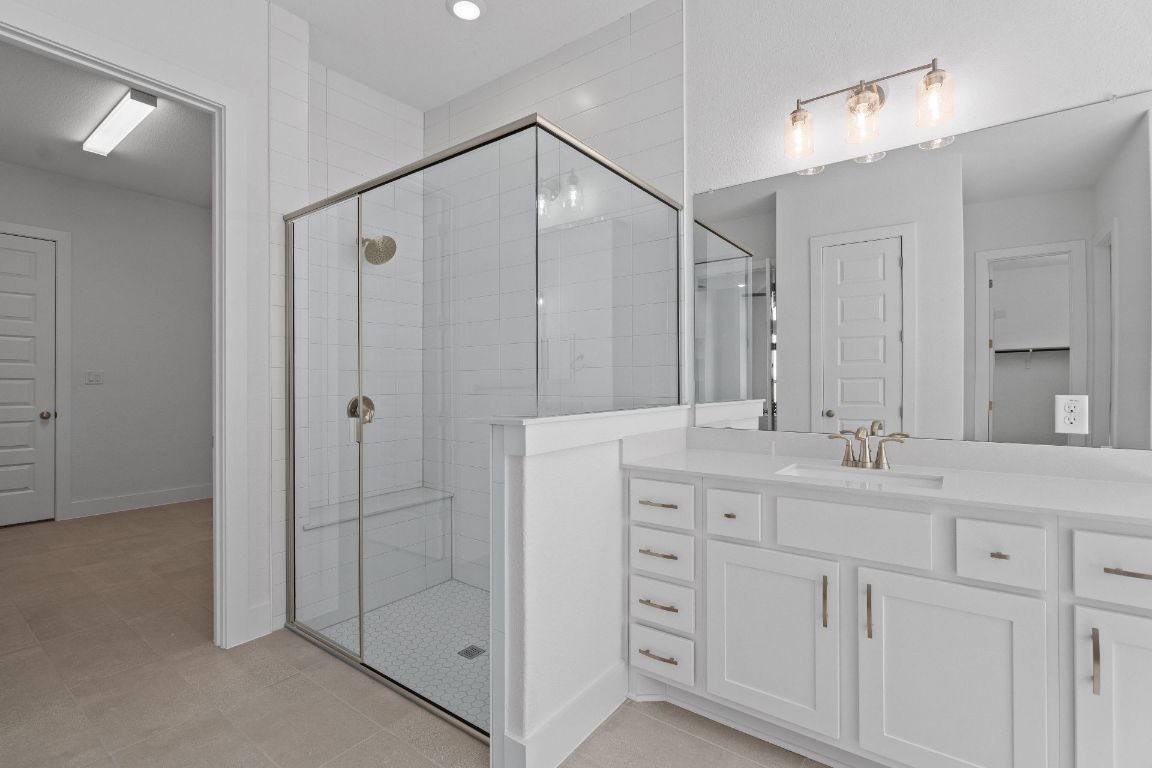 816 South Hemingway Loop Liberty Hill, TX 78642 - Photo 18 of 40 Primary Bath retreat with dual vanities & Walk-in Shower
