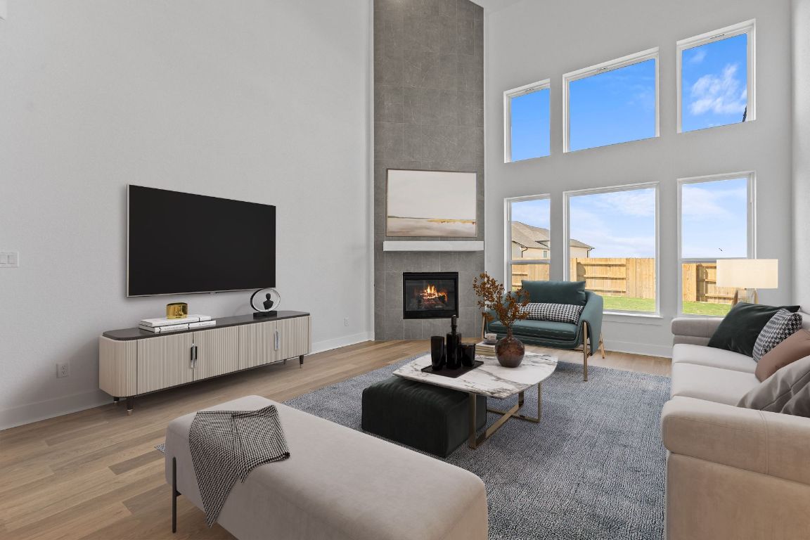 816 South Hemingway Loop Liberty Hill, TX 78642 - Photo 4 of 40 Open Concept Family Room - Virtually Staged