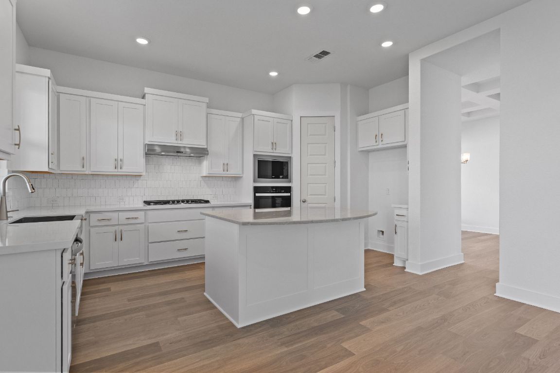 816 South Hemingway Loop Liberty Hill, TX 78642 - Photo 7 of 40 Open Concept Kitchen