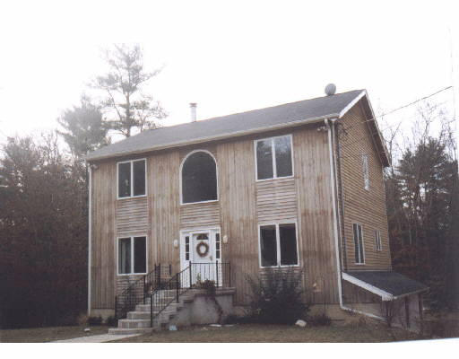 591 Delano Road Marion, MA 02738 - Photo 1 of 1 a view of a house with a backyard