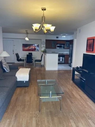 a kitchen with stainless steel appliances granite countertop a sink and a microwave
