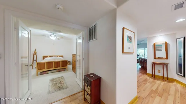 a view of living room filled with furniture and wooden floor