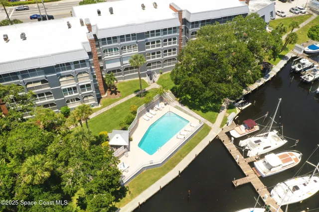 an aerial view of residential houses with outdoor space