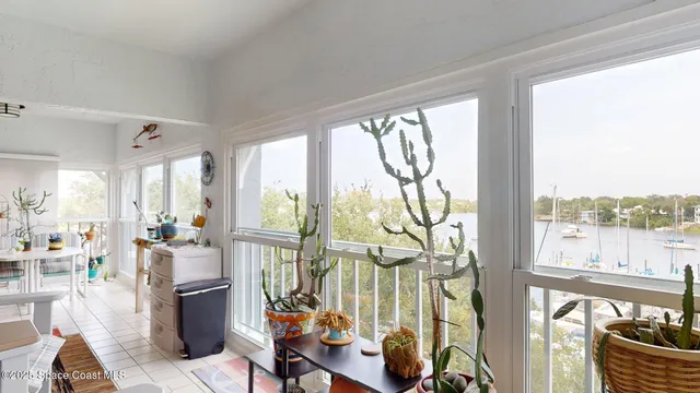 a room with lots of furniture and a large window