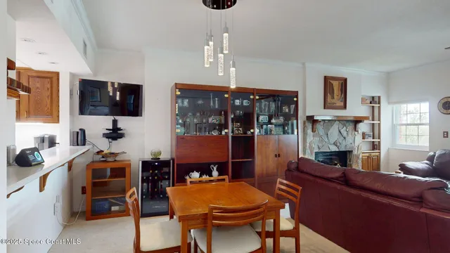 a view of a livingroom with furniture and a flat screen tv