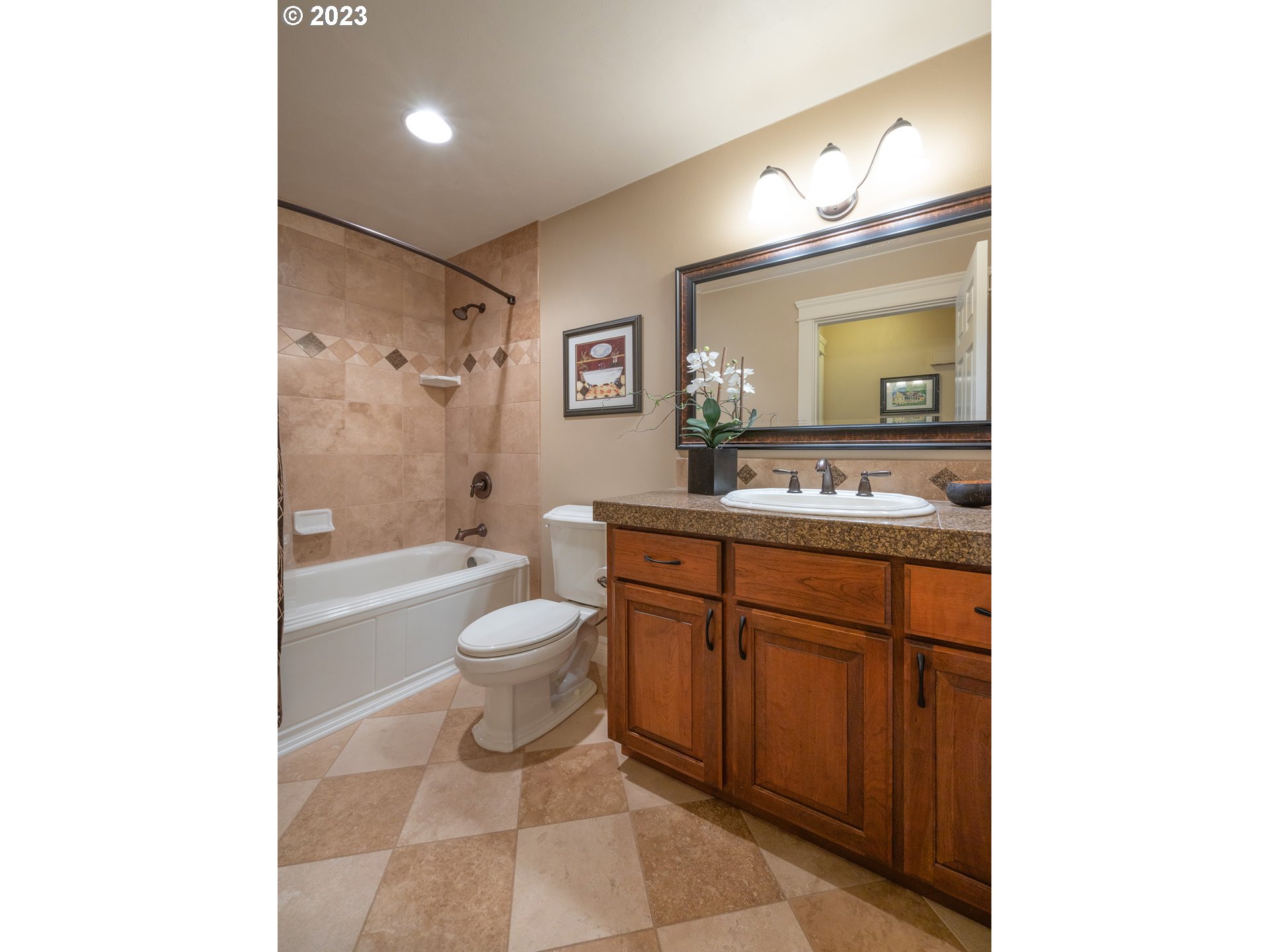 37692 Wheeler Road Dexter, OR 97431 - Photo 22 of 48 a bathroom with a granite countertop sink toilet mirror vanity and a bathtub
