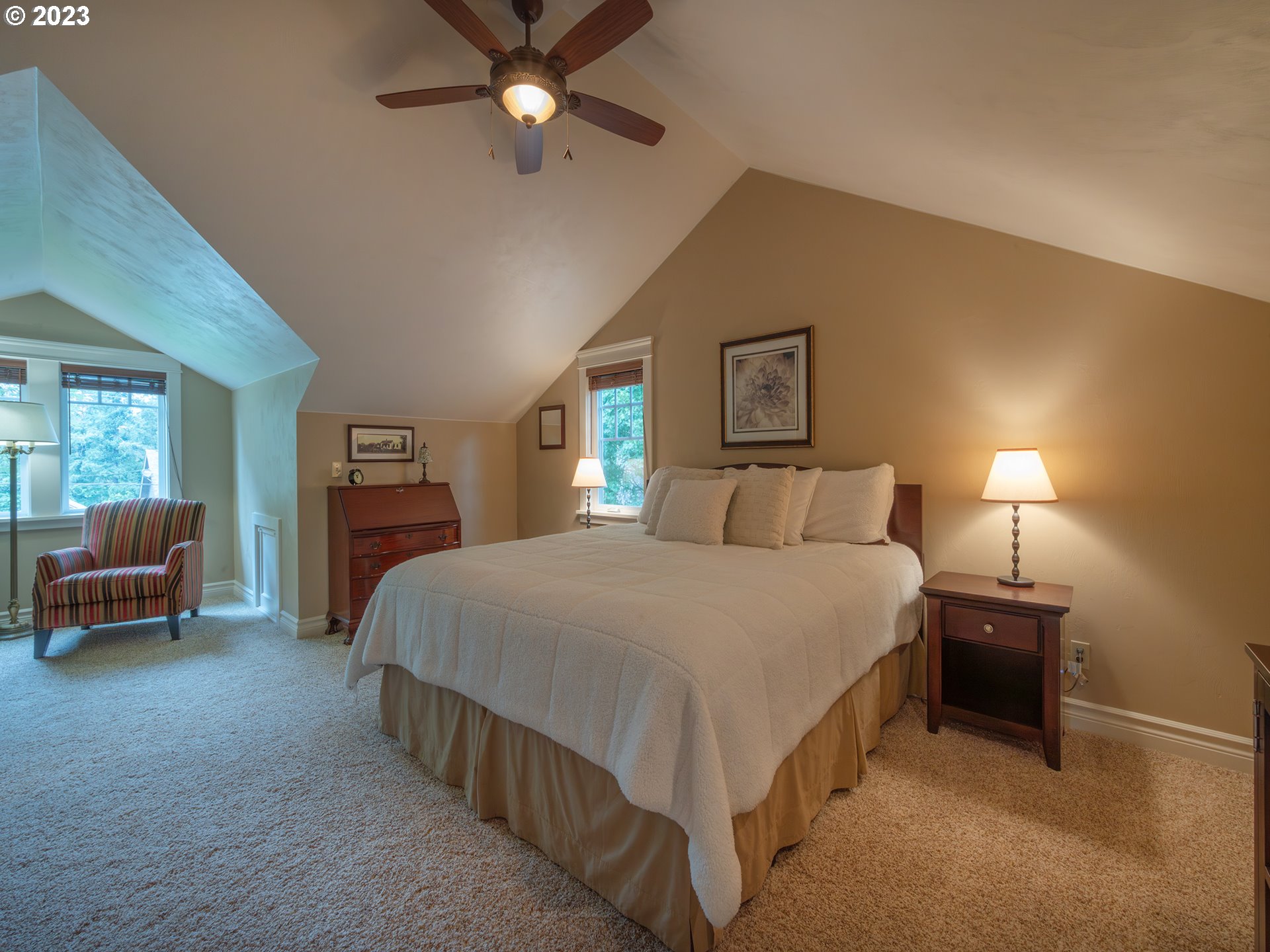 37692 Wheeler Road Dexter, OR 97431 - Photo 26 of 48 a spacious bedroom with a bed and a chandelier