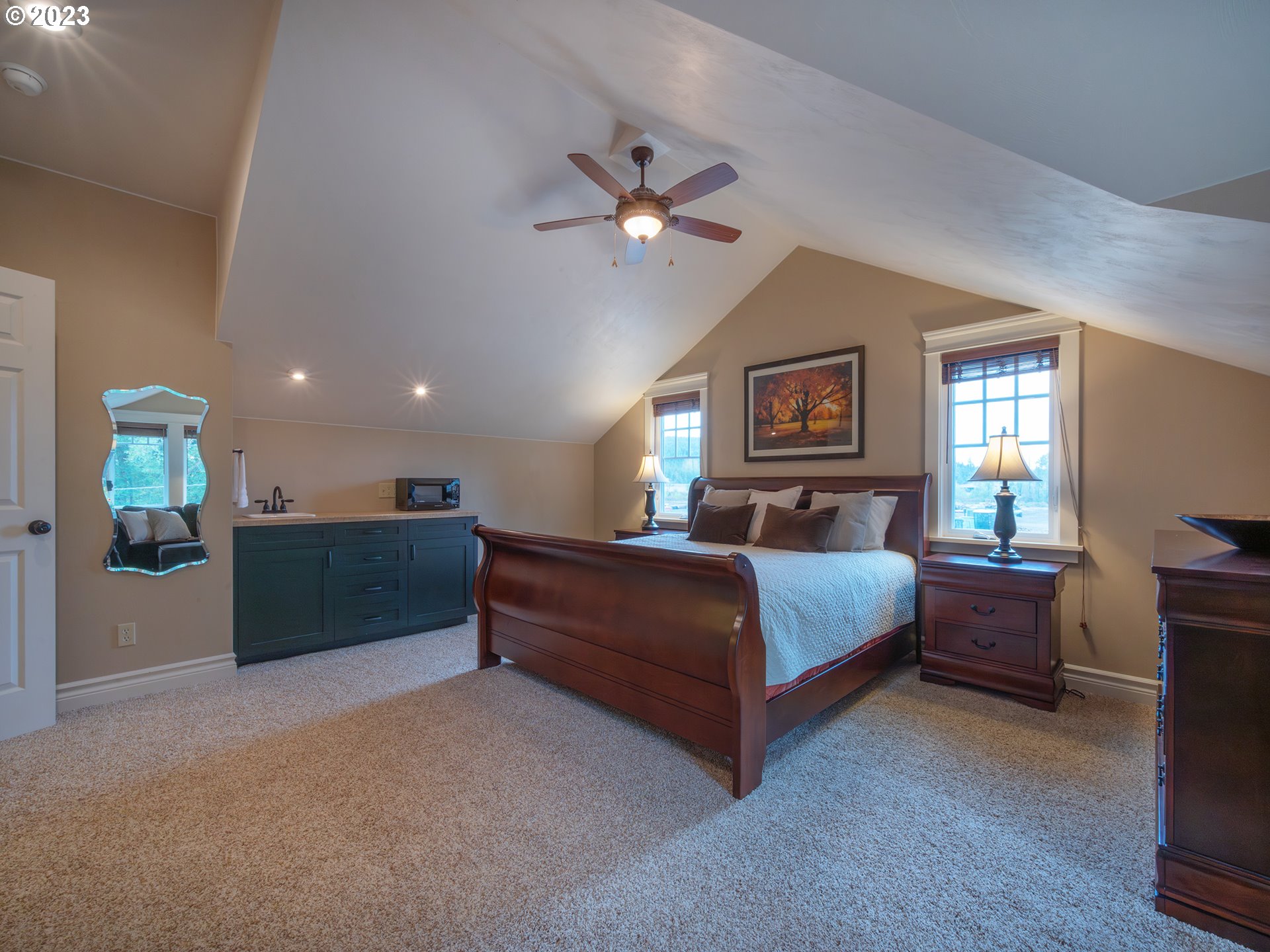 37692 Wheeler Road Dexter, OR 97431 - Photo 29 of 48 a bedroom with a bed and a chandelier