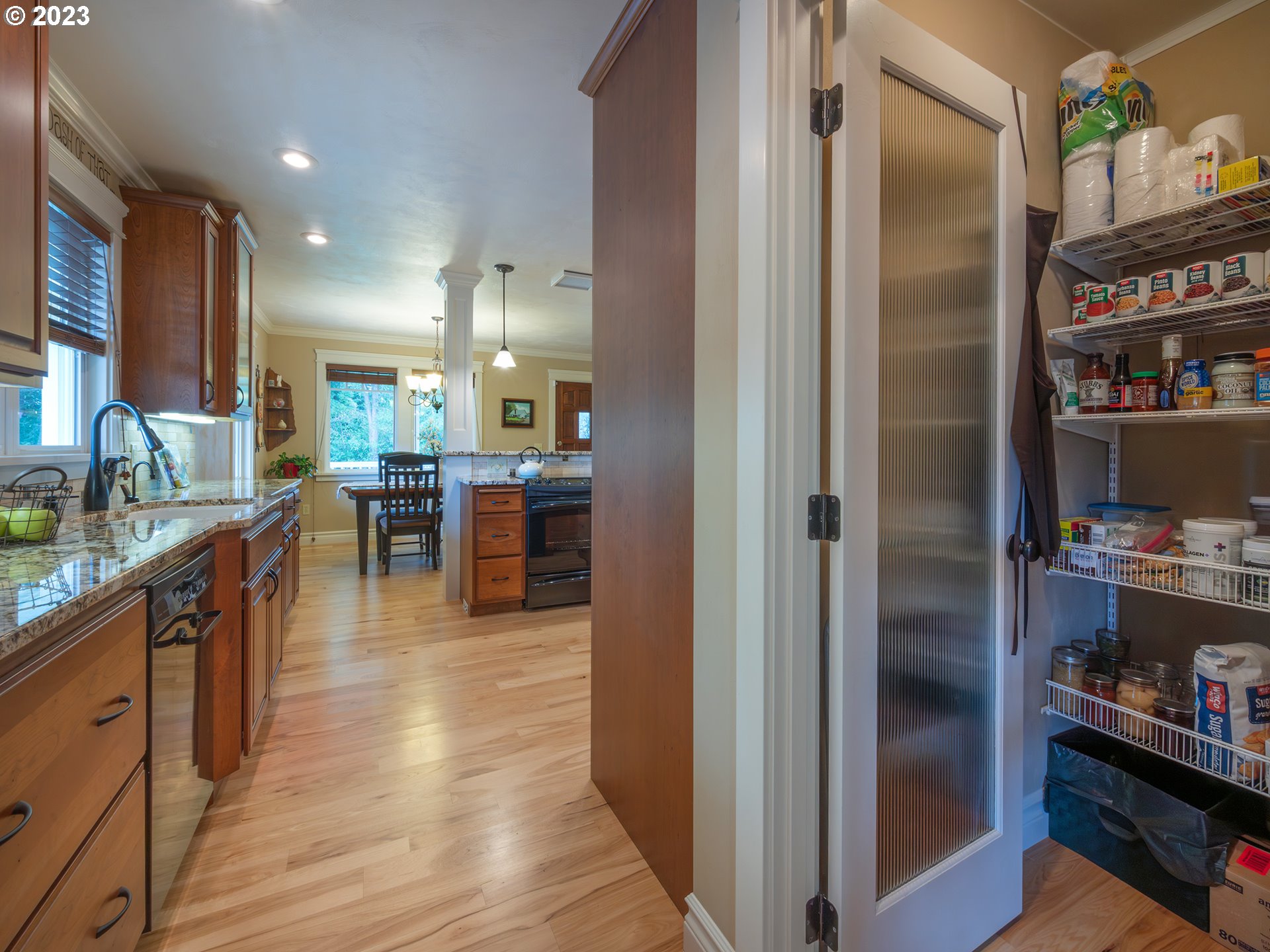 37692 Wheeler Road Dexter, OR 97431 - Photo 34 of 48 a kitchen with stainless steel appliances granite countertop refrigerator and cabinets