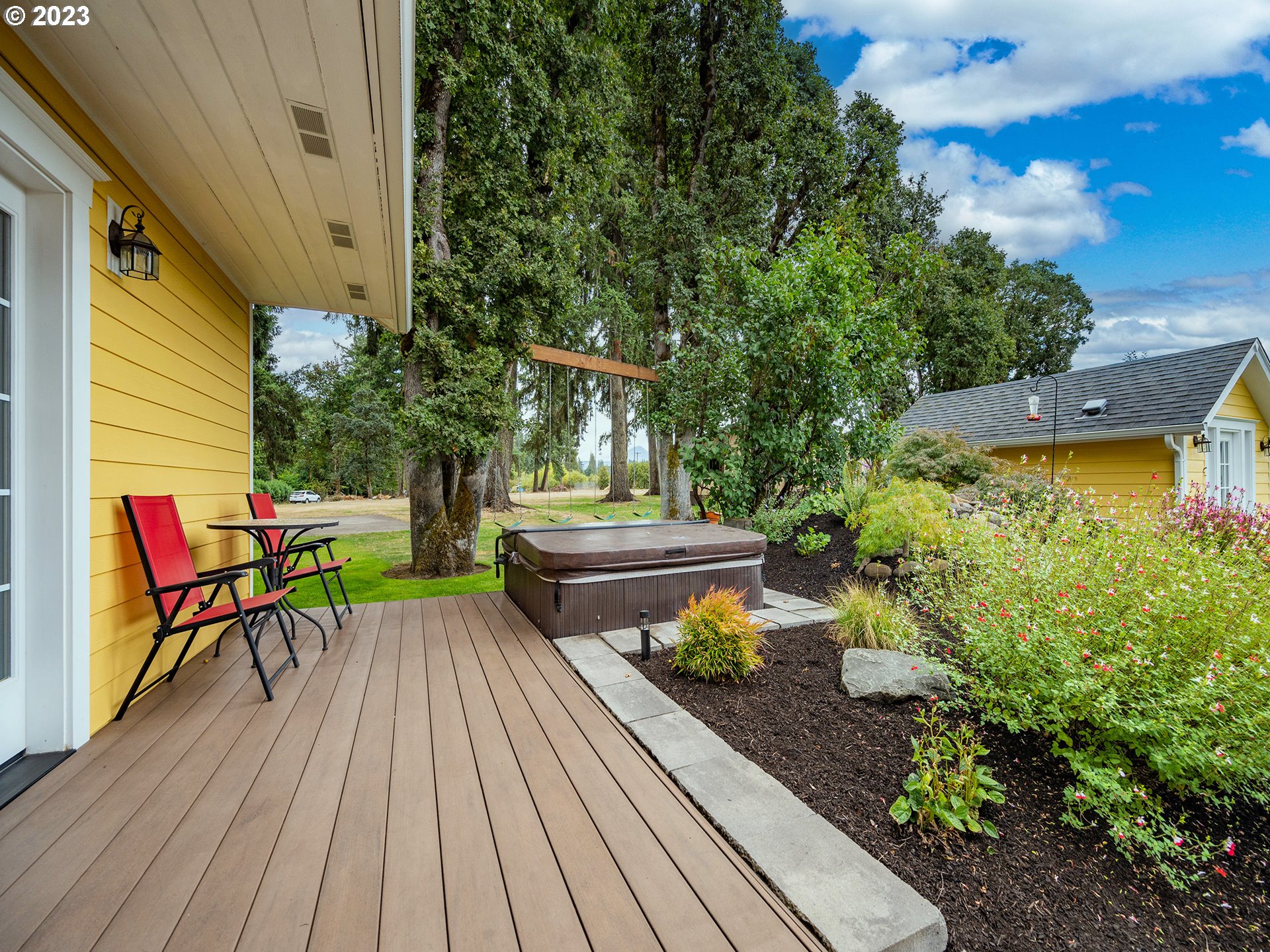 37692 Wheeler Road Dexter, OR 97431 - Photo 35 of 48 a view of a chairs and table on the wooden deck