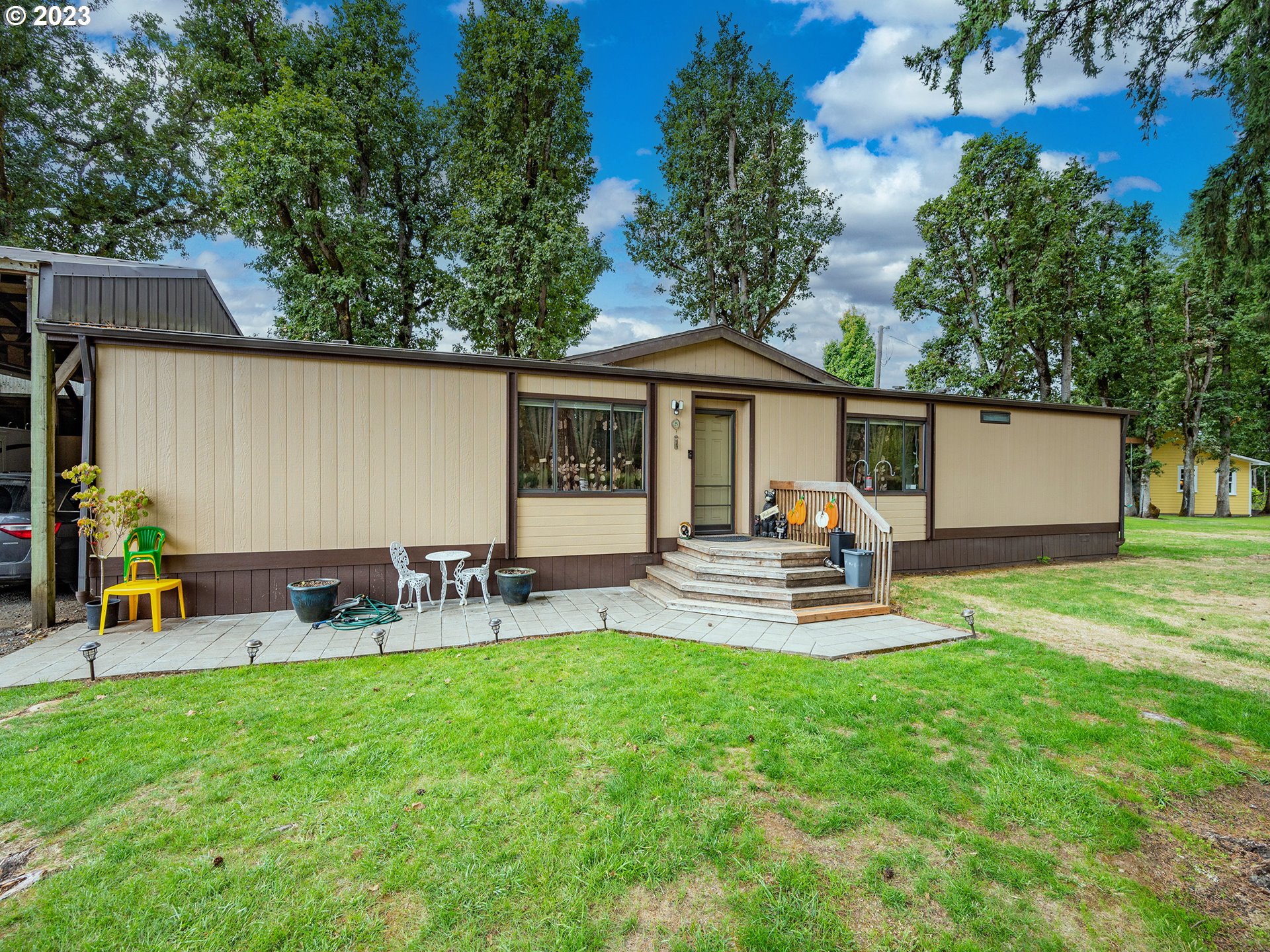 37692 Wheeler Road Dexter, OR 97431 - Photo 47 of 48 a front view of a house with patio and garden
