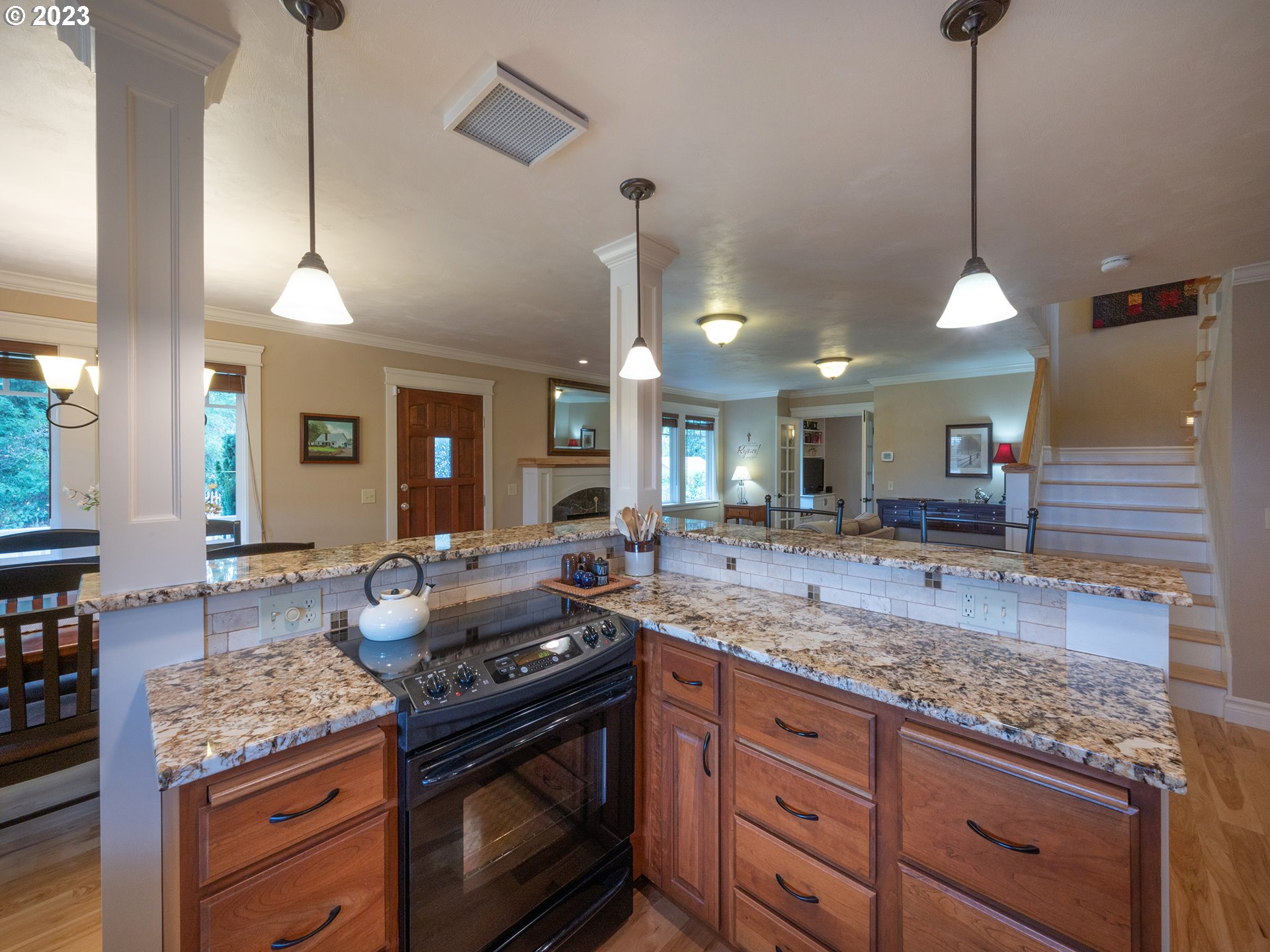 37692 Wheeler Road Dexter, OR 97431 - Photo 10 of 48 a kitchen with granite countertop stove and cabinets