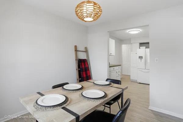 a kitchen with cabinets appliances and a sink