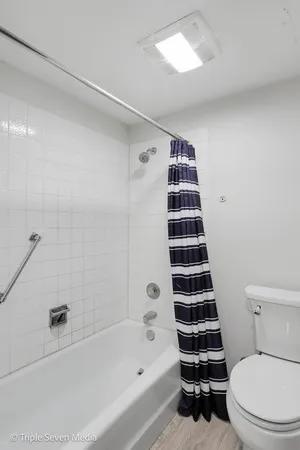 a utility room with a refrigerator a washer and dryer