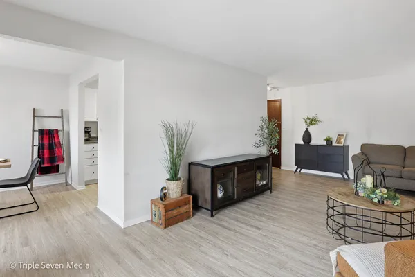 a living room with furniture and a window