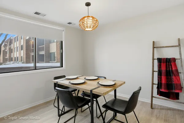 a view of a dining room with furniture