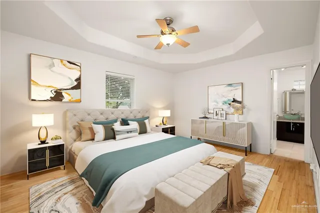 a bedroom with a bed and a chandelier