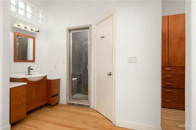 a bathroom with a double vanity sink and mirror
