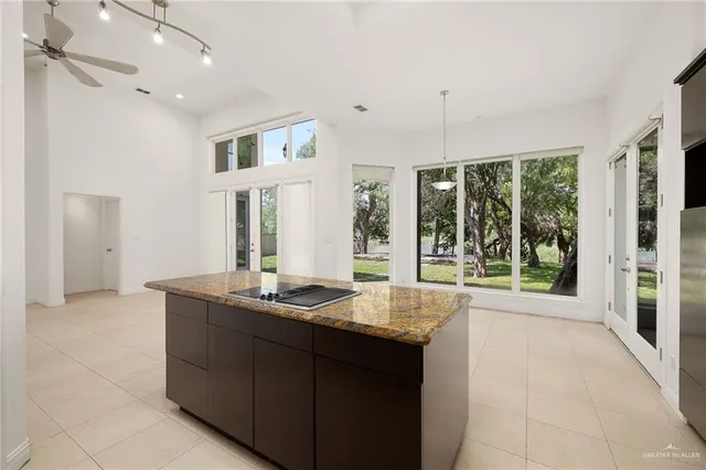 a living room with granite countertop furniture and a floor to ceiling window