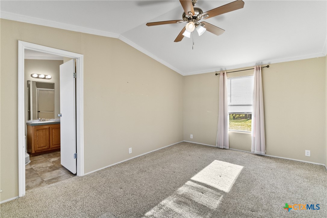 705 Peabody Street Edna, TX 77957 - Photo 12 of 24 a view of an empty room with a window