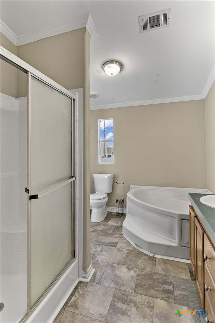 705 Peabody Street Edna, TX 77957 - Photo 16 of 24 a bathroom with a toilet and a shower