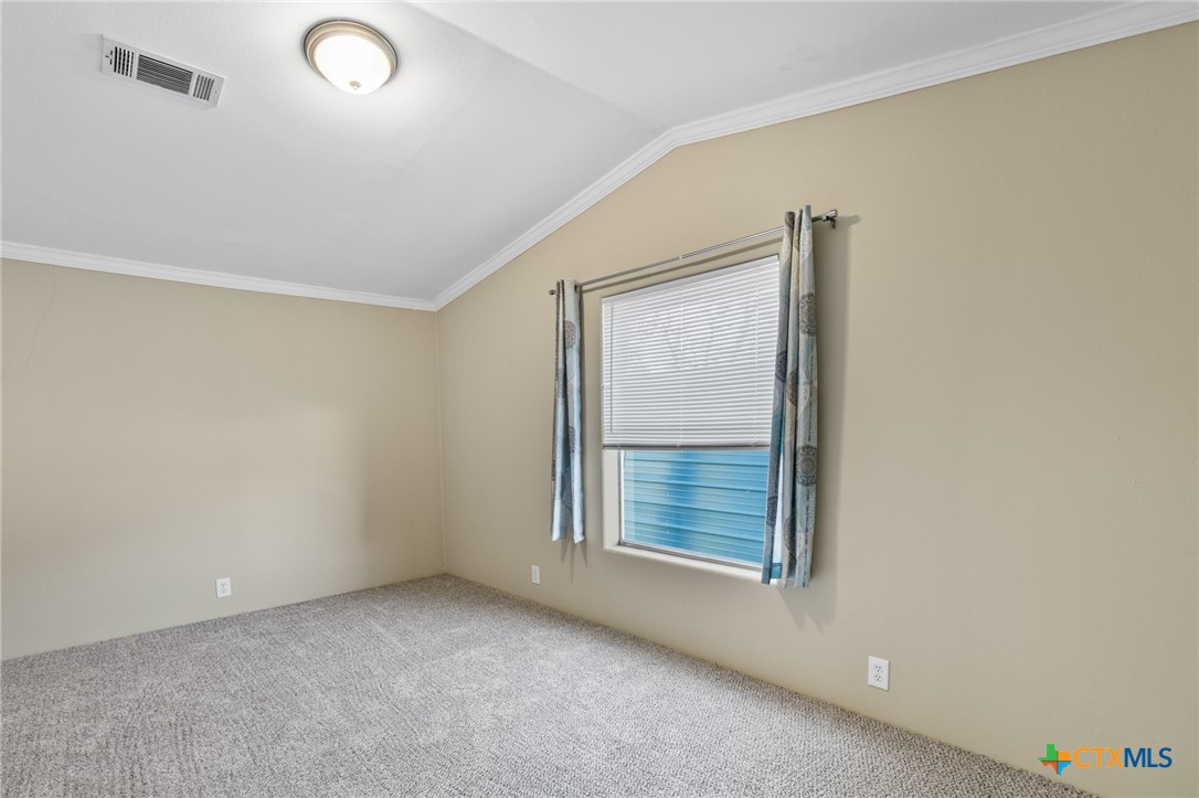 705 Peabody Street Edna, TX 77957 - Photo 17 of 24 an empty room with windows