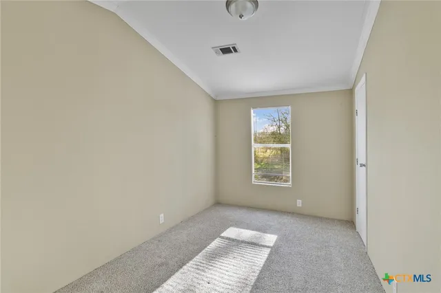 a view of an empty room and window