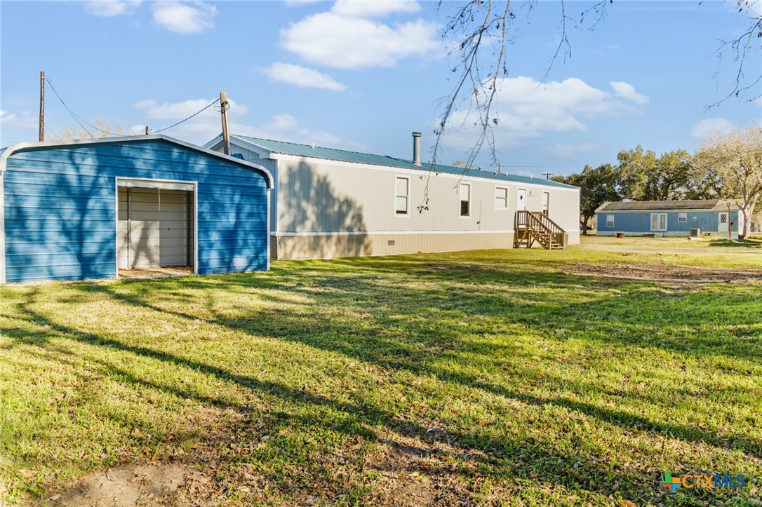 705 Peabody Street Edna, TX 77957 - Photo 24 of 24 a swimming pool with an outdoor space